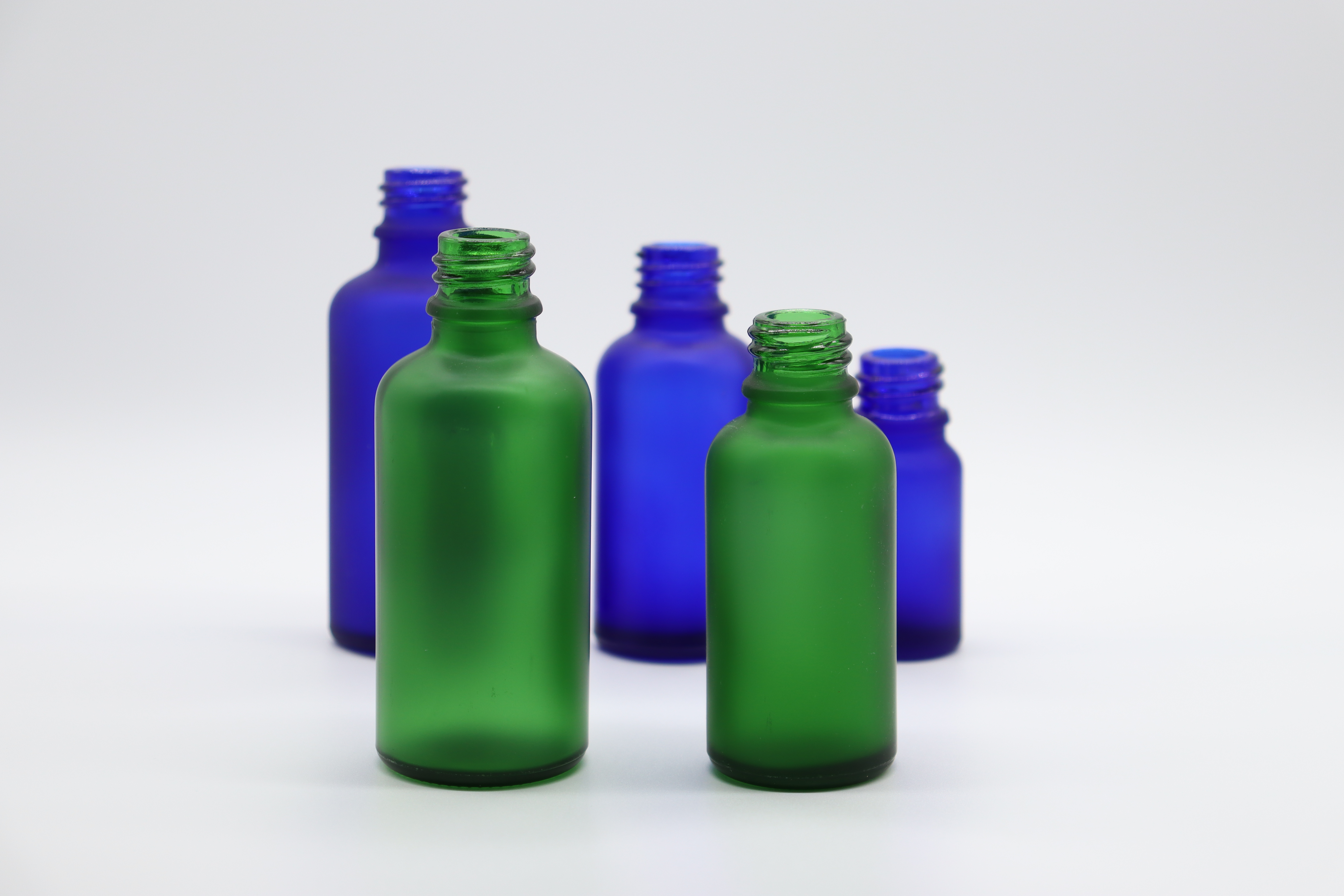 Green and blue color glass dropper bottle